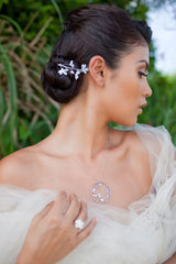 Shown with pave white sapphire Sakura ring and silver Sakura circle pendant.